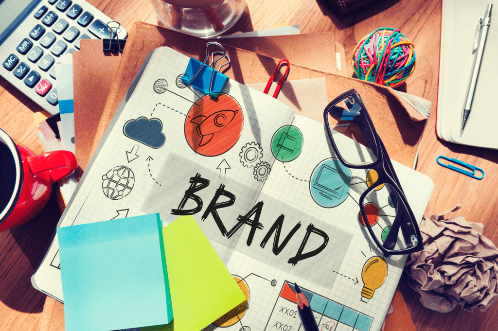 Brand building and marketing strategy concept with sketches, icons, and creative planning workspace